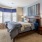 a bedroom with a bed and a desk