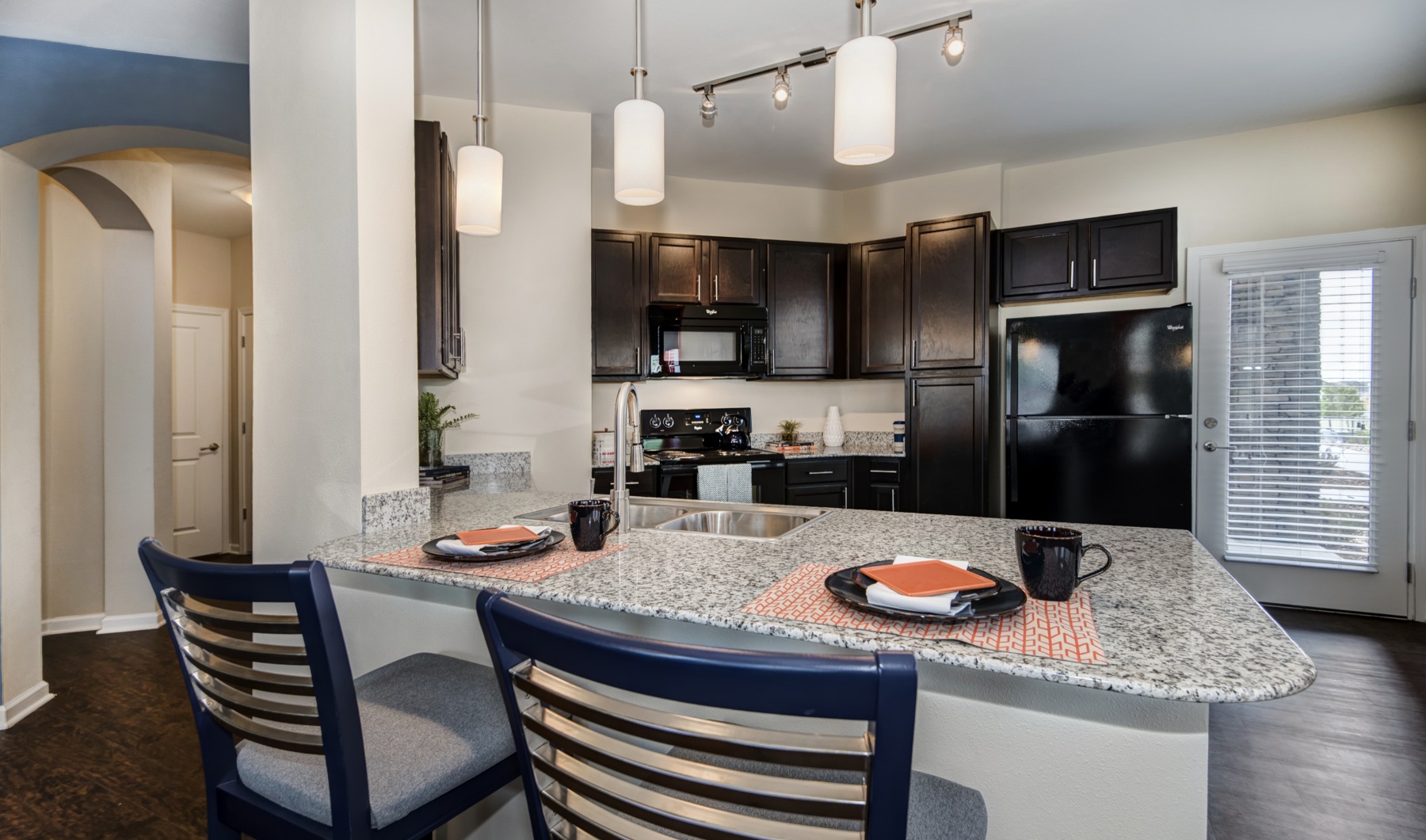 a kitchen with white cabinets