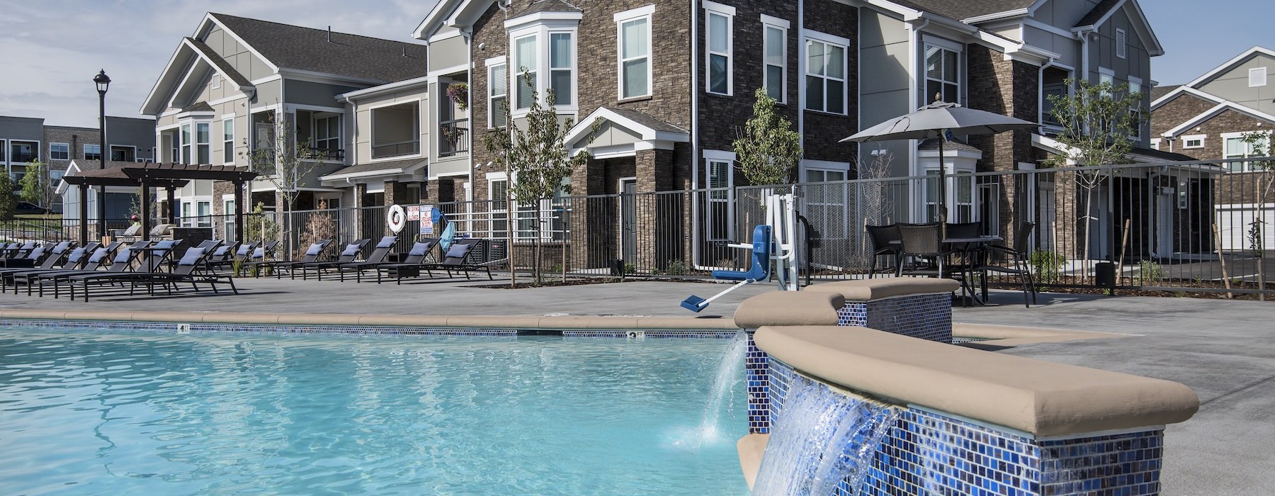 a swimming pool in front of a building
