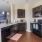 a kitchen with black appliances