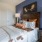 a bedroom with a bed and lamps